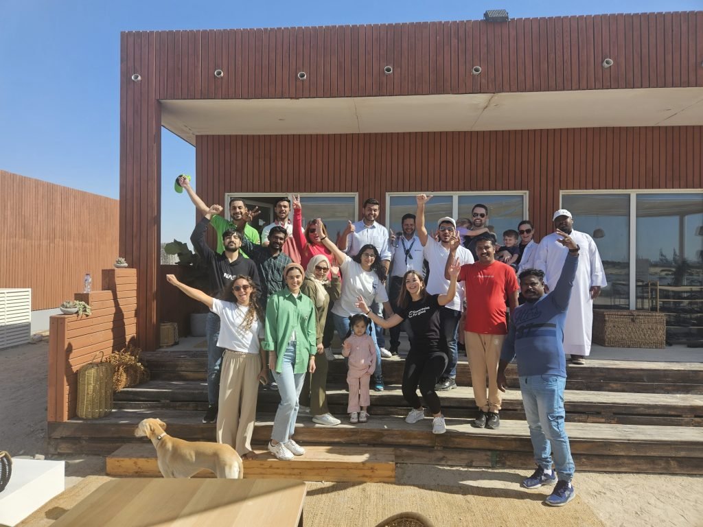happy individual posing after desert cleaning activity in dubai