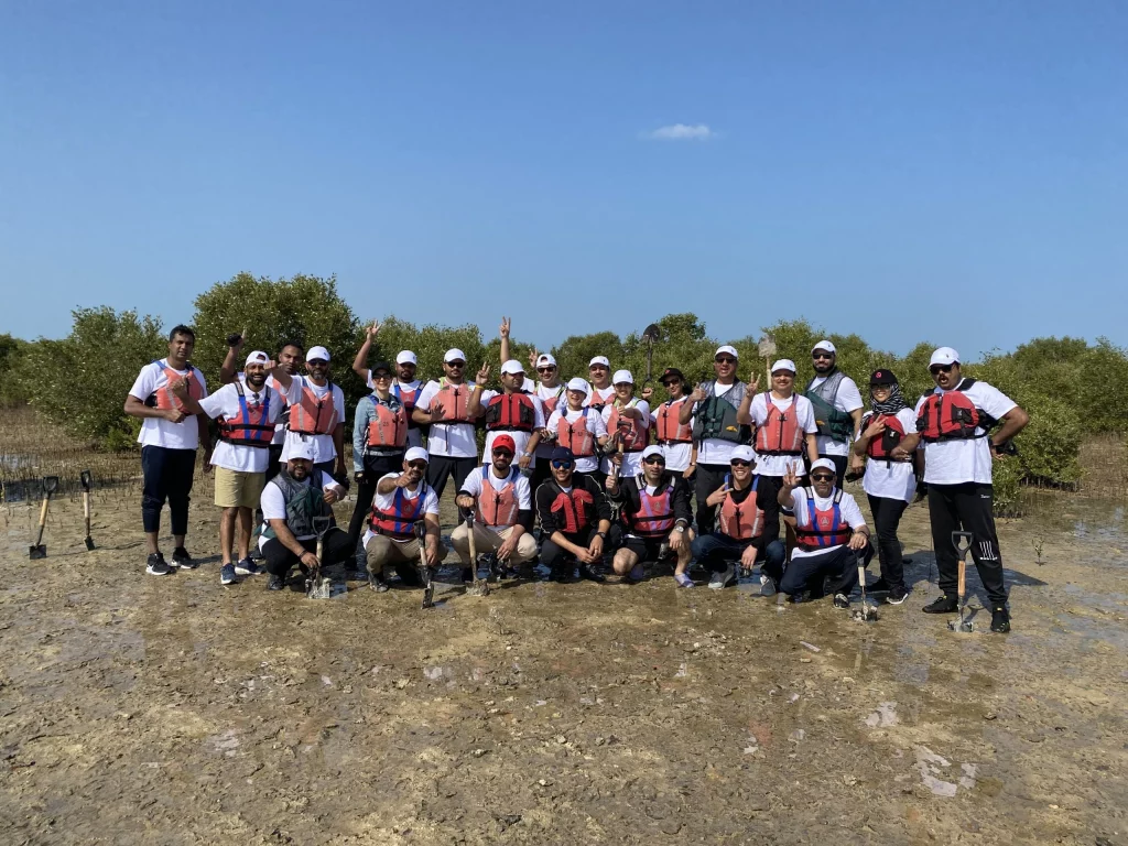 group of individual posing after ready for kayking in dubai