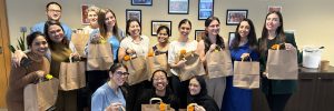 group of happy employee posing after packing parcels