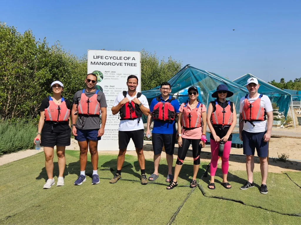 people ready for kayking activity after planting mangrove plants in uae