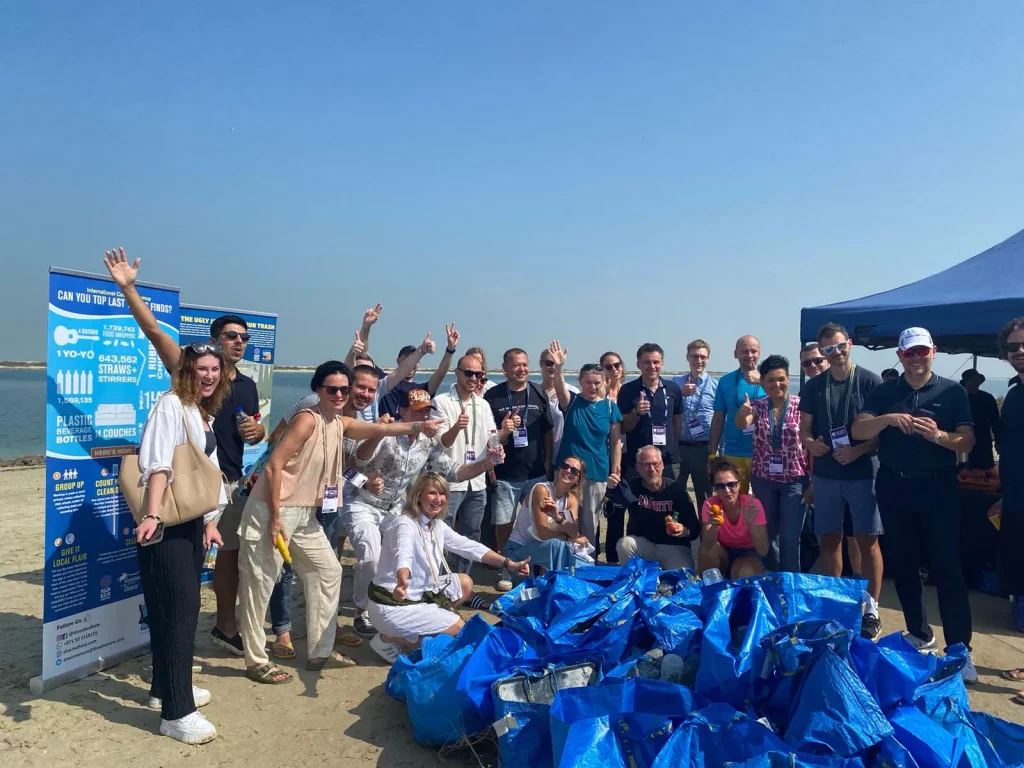 ICCA team poses happily for Join Beach Cleanup Activity in Abu Dhabi