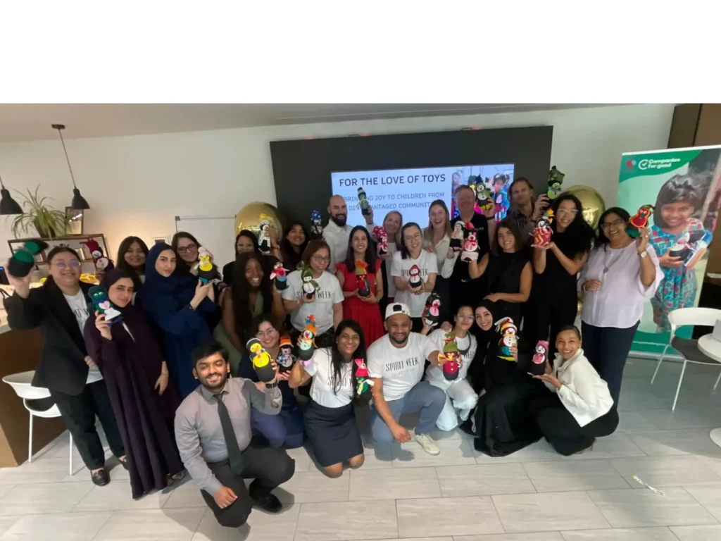 Jumeirah Team poses after Packing Care Parcels for children