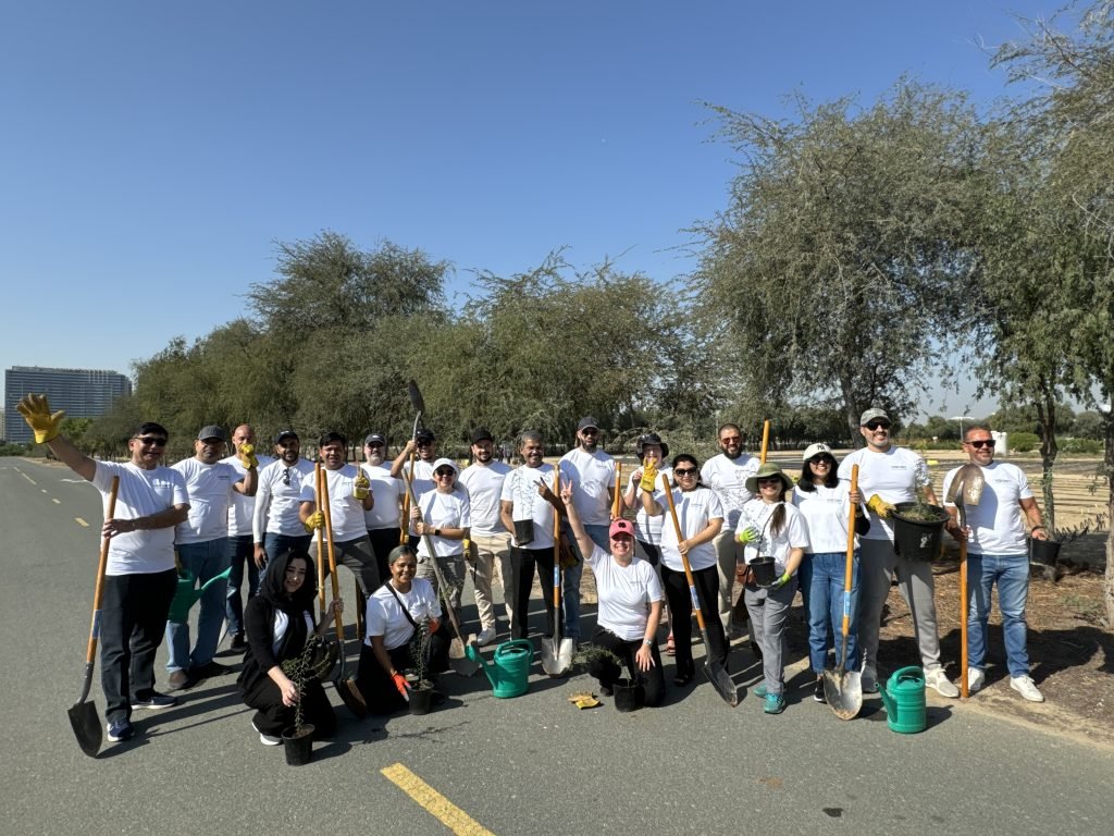 Volunteers in white clean roadside with shovels