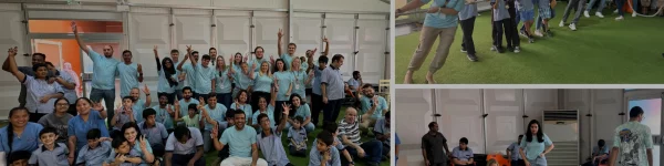 A group of diverse individuals in matching light blue shirts celebrate joyfully together, with some activities and interactions captured.