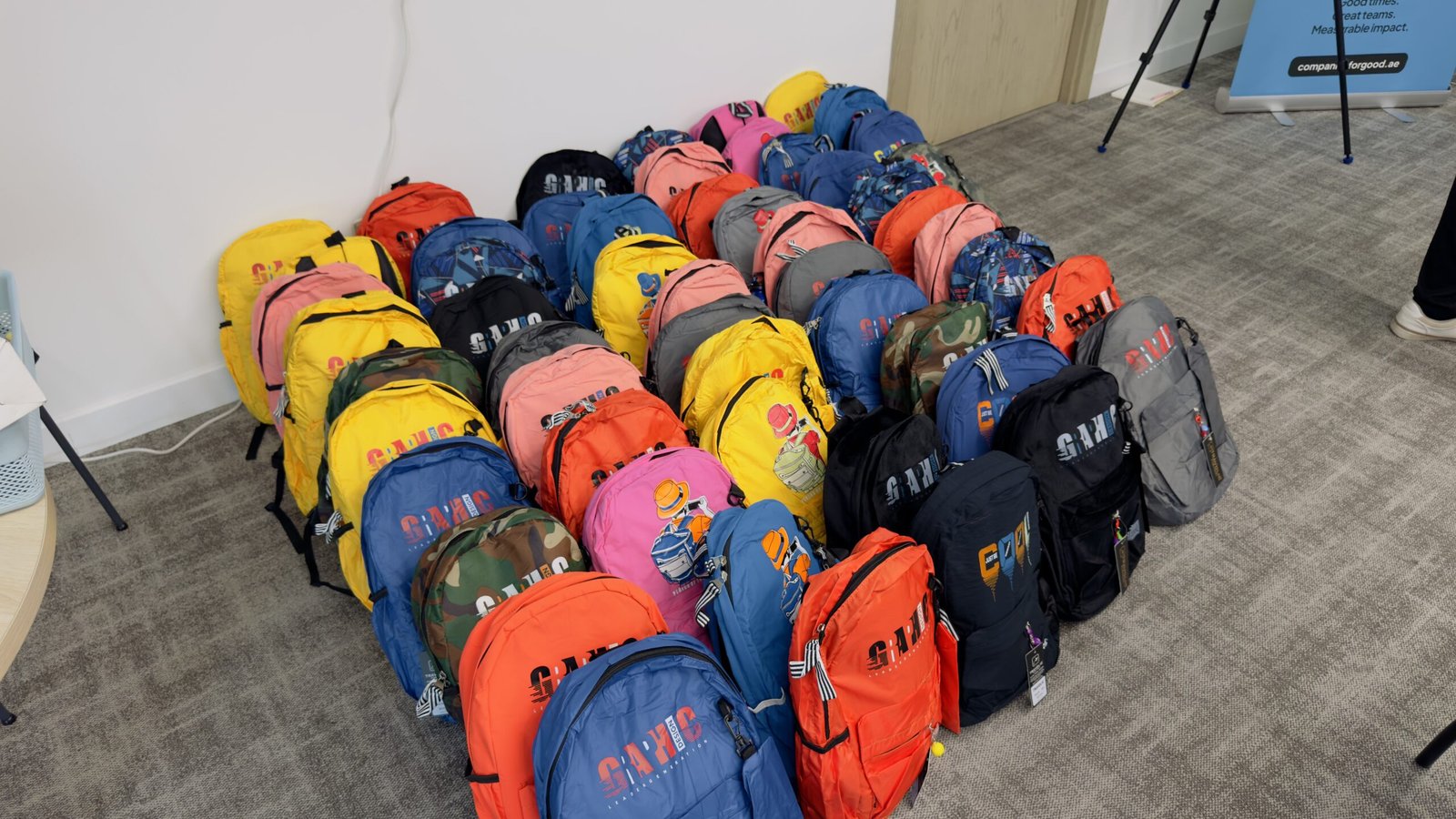 Team preparing personalised backpacks